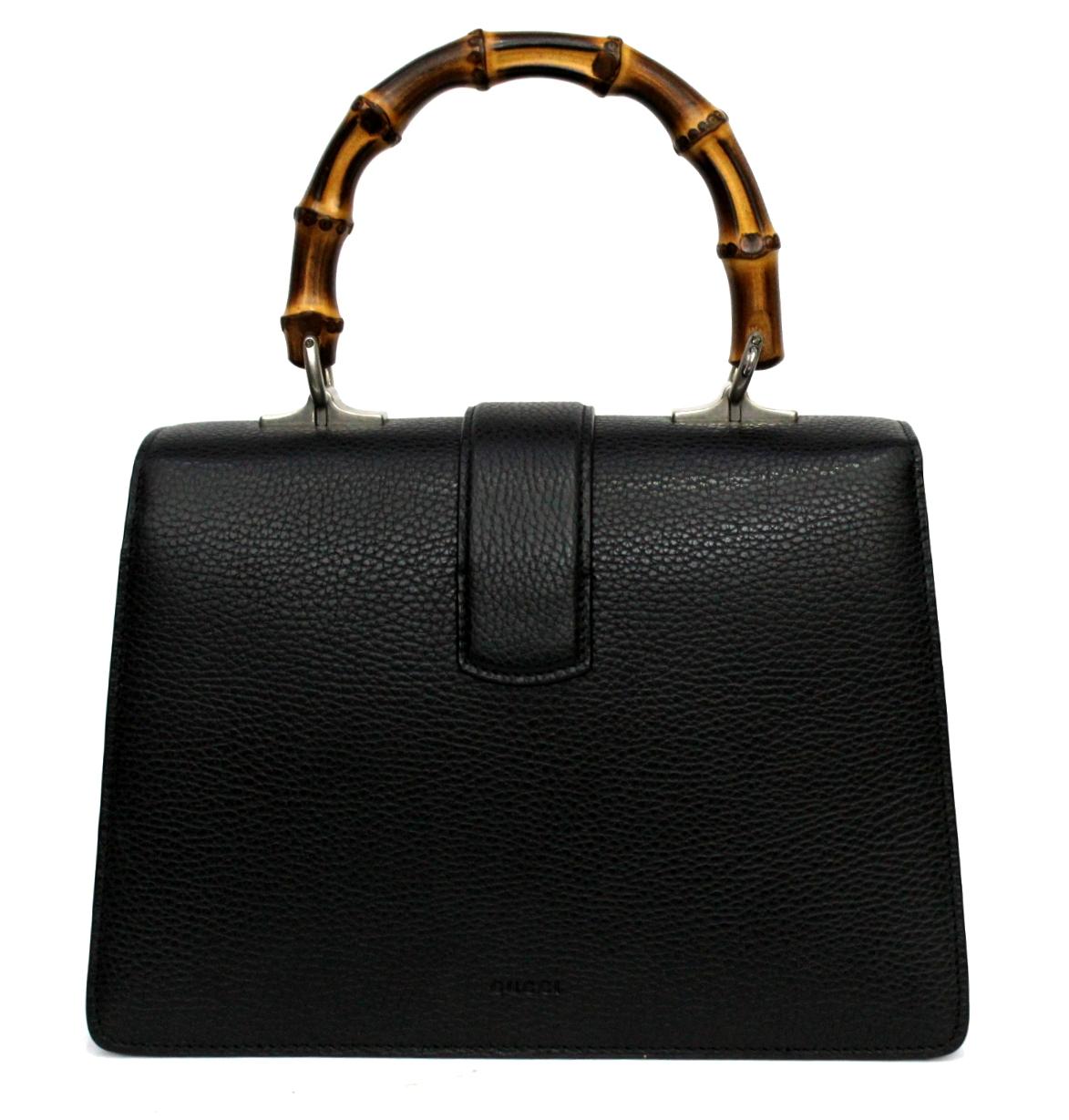 Gucci Dionysus bag made of black hammock leather and bamboo handle. the closure is particular, embellished by the head of tiger and swaroski. the bag is like new but does not have its shoulder strap.