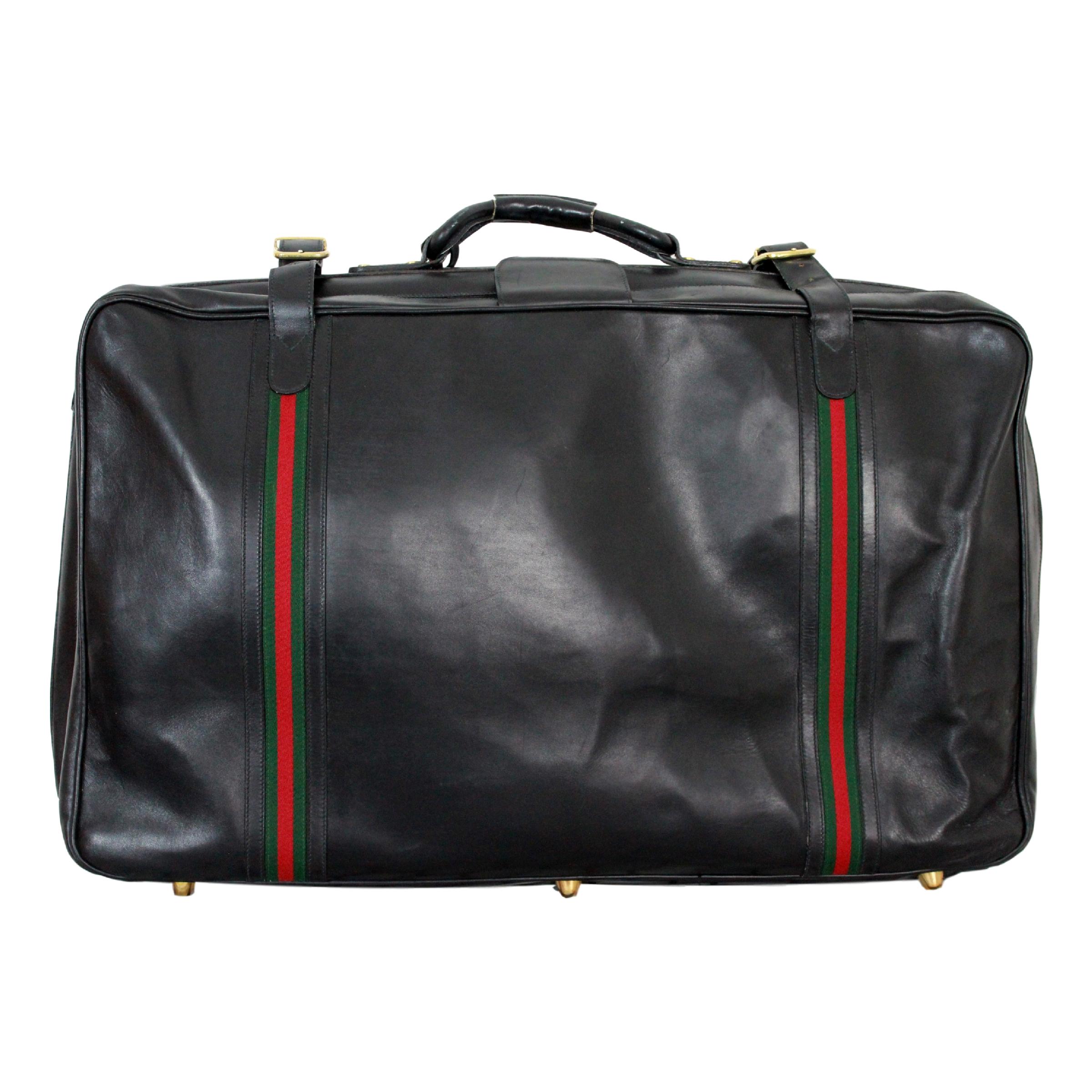 black gucci luggage set