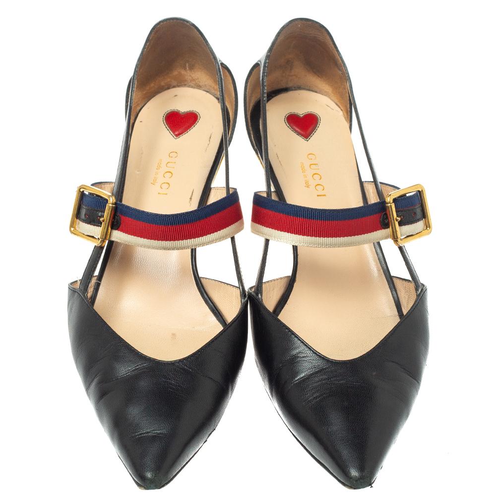 These pointed-toe pumps from Gucci have come straight from a shoe lover's dream. Crafted from black leather, detailed with Web straps, and balanced on 4.5 cm bamboo heels, the pumps are lovely and gorgeous!

Includes: Original Box, Original Dustbag,