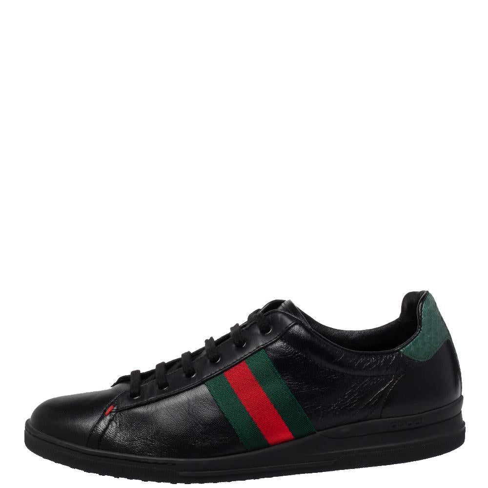 Stacked with signature details, this Gucci pair is rendered in leather and is designed in a low-cut style with lace-up vamps. They have been fashioned with the iconic Web stripes. Complete with green heel counters made from python-embossed leather,