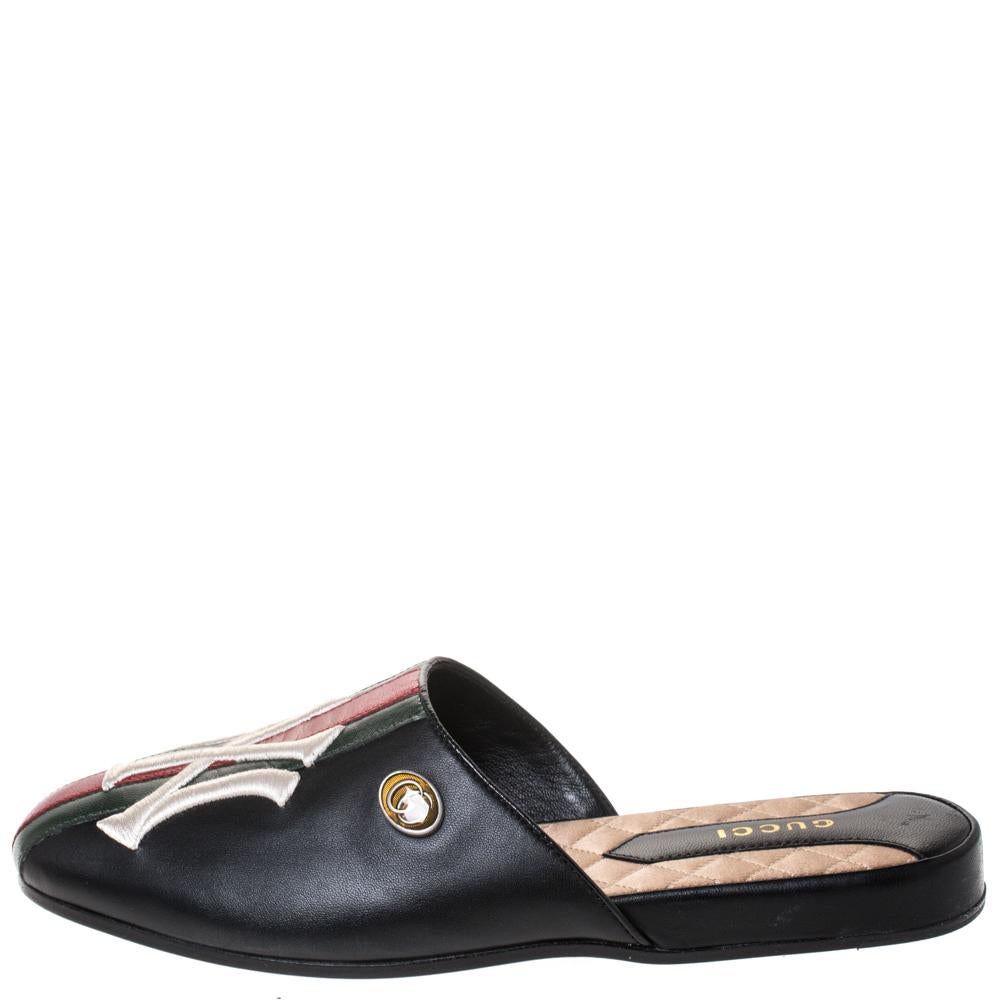 These mules from Gucci will lend a stylish and playful edge to your feet. This gorgeous pair of flats is made of leather and is styled with web accents and NY embroidery on the vamps. Exhibit your impressive styling sense when you don these black