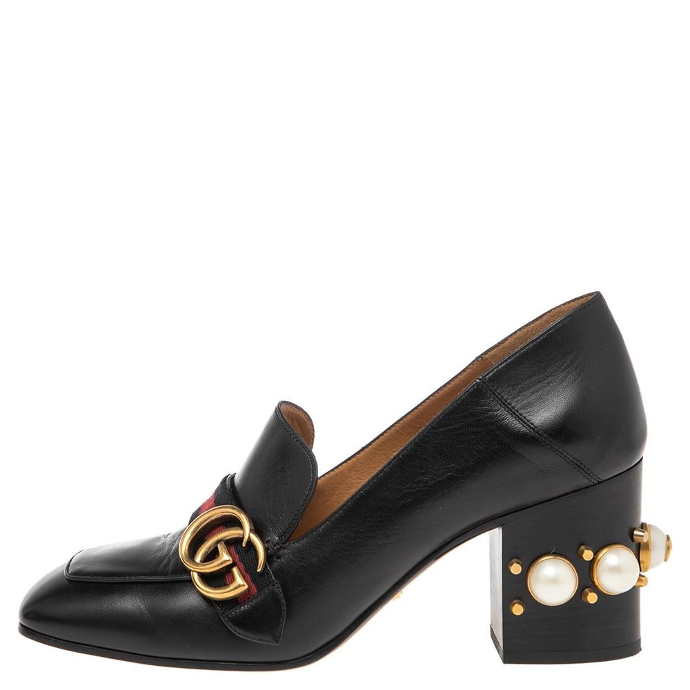 Brimming with signature details, these Gucci loafer pumps made of leather will certainly bring you a stunning look. While the vamps are adorned with a gold-tone GG motif and the Web trim, the heels are decorated with GG faux pearls and studs. Revamp