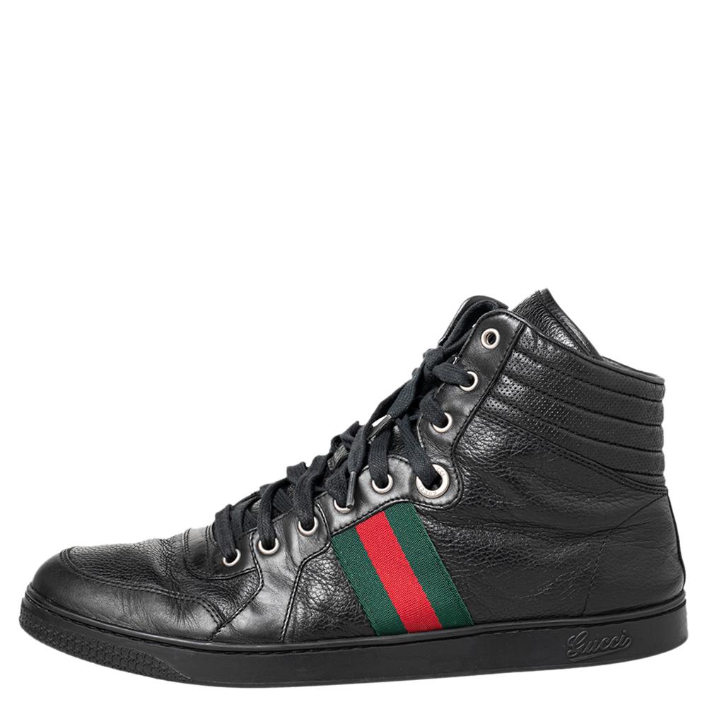 A simple high-top design is updated with Gucci's Web trim to form these luxe black sneakers for men. Set on a lightweight rubber sole, this pair is detailed with tonal stitching and laces on the vamps. Style yours with smart casuals.


