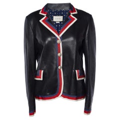 Gucci Schwarze Lederjacke mit Webbesatz und applizierter Knopfleiste an der Vorderseite L