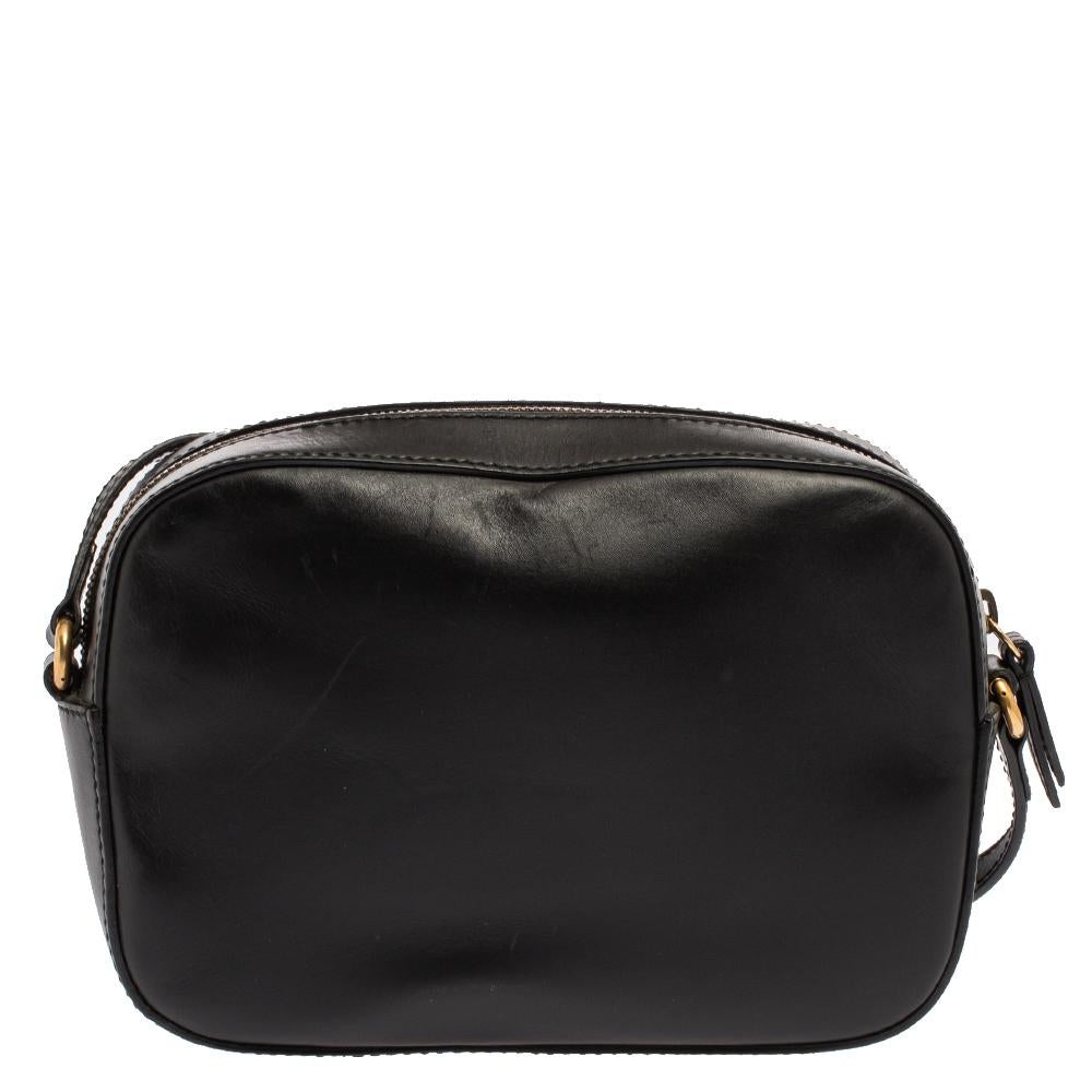 This chic bag from Gucci will enhance both your casual and evening wear. Crafted with quality leather, the black bag features beautiful web detailing, a bee motif and a long shoulder strap. This crossbody bag is equipped with a top zip closure that
