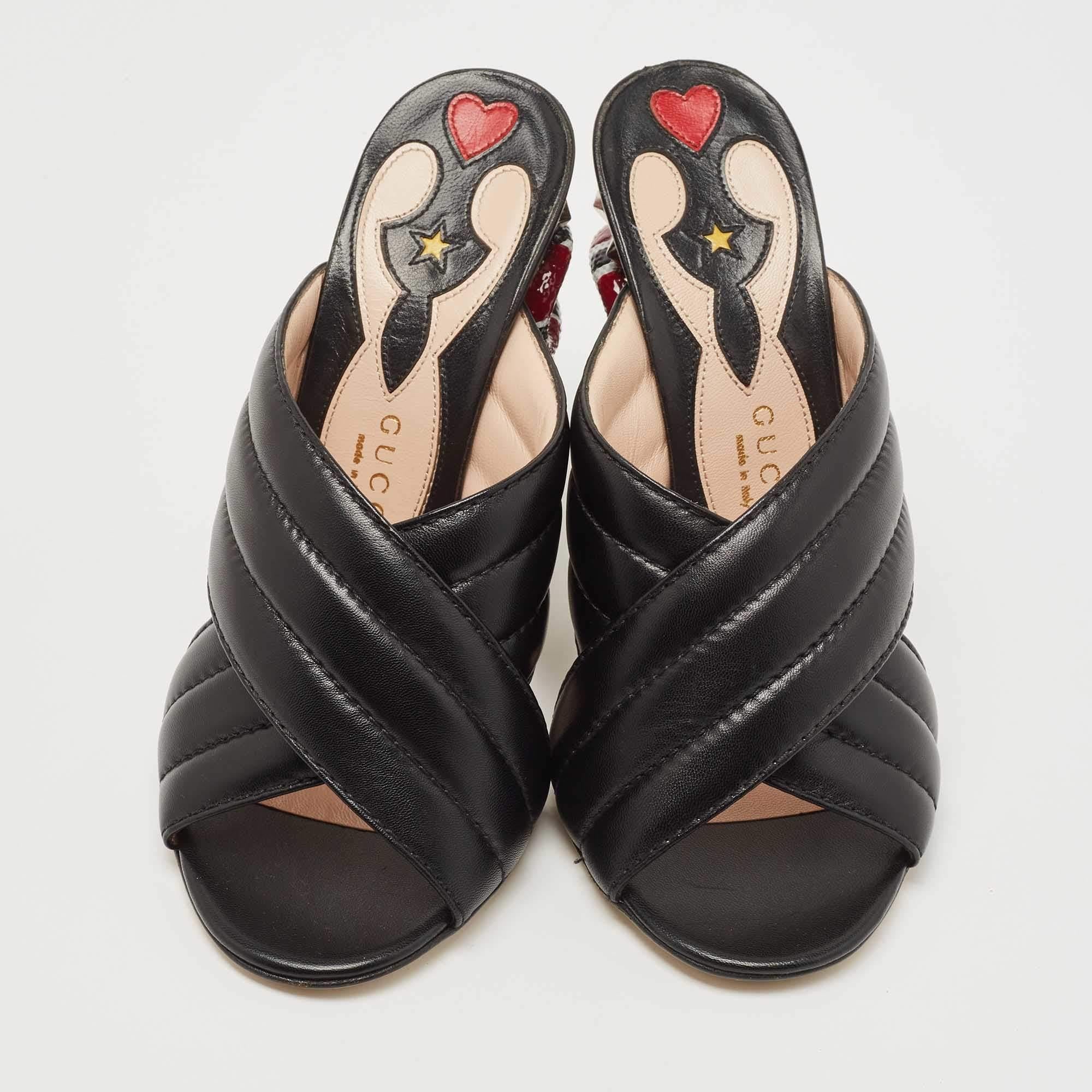 Deliver statement looks with these slides from Gucci! From their shape and detailing to their overall appeal, they exude sophisticated style. The sandals come crafted from black leather and feature front crisscross straps and embellished block
