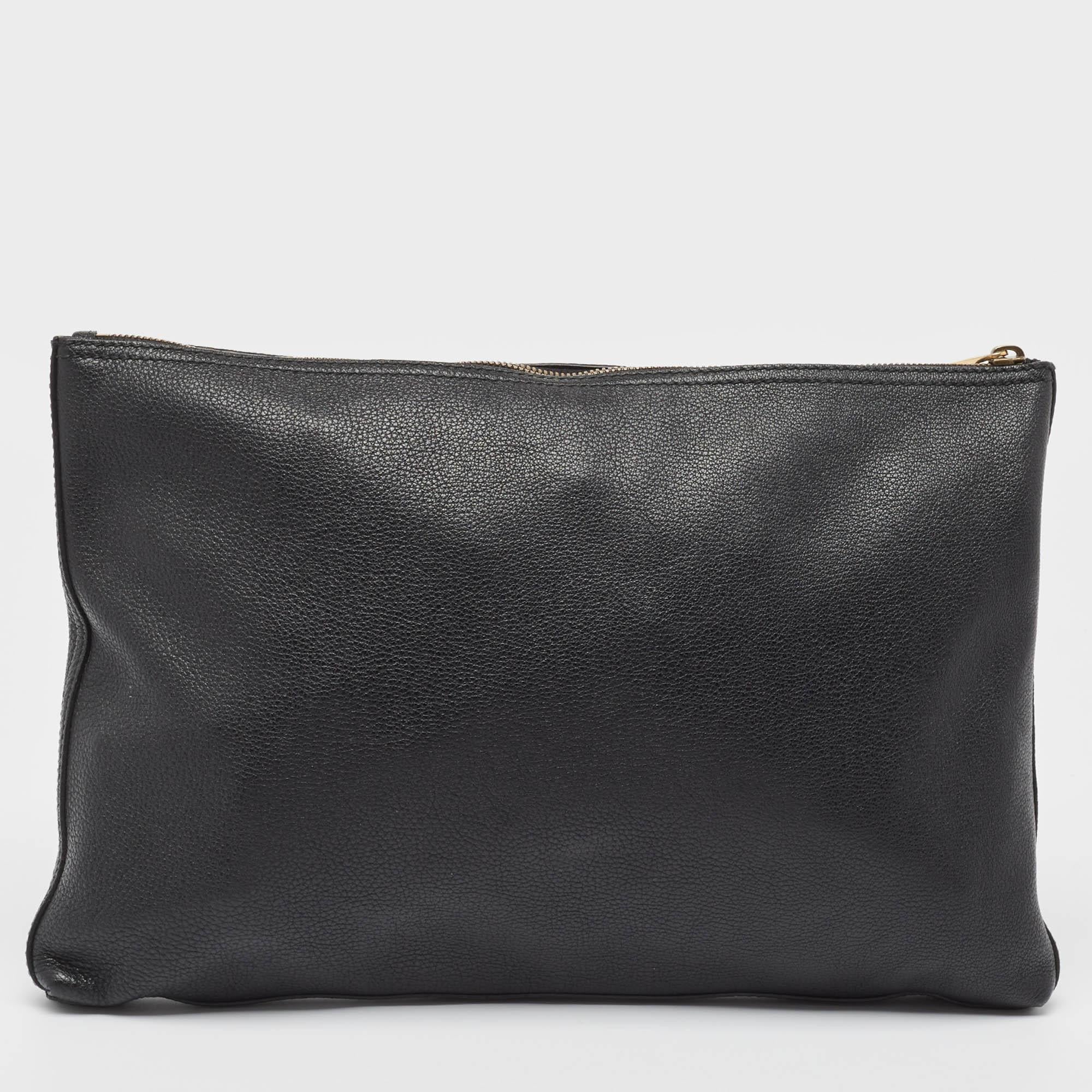 Marked by flawless craftsmanship and enduring appeal, this Gucci pouch for men is bound to be a versatile and durable accessory. It has a spacious size.

