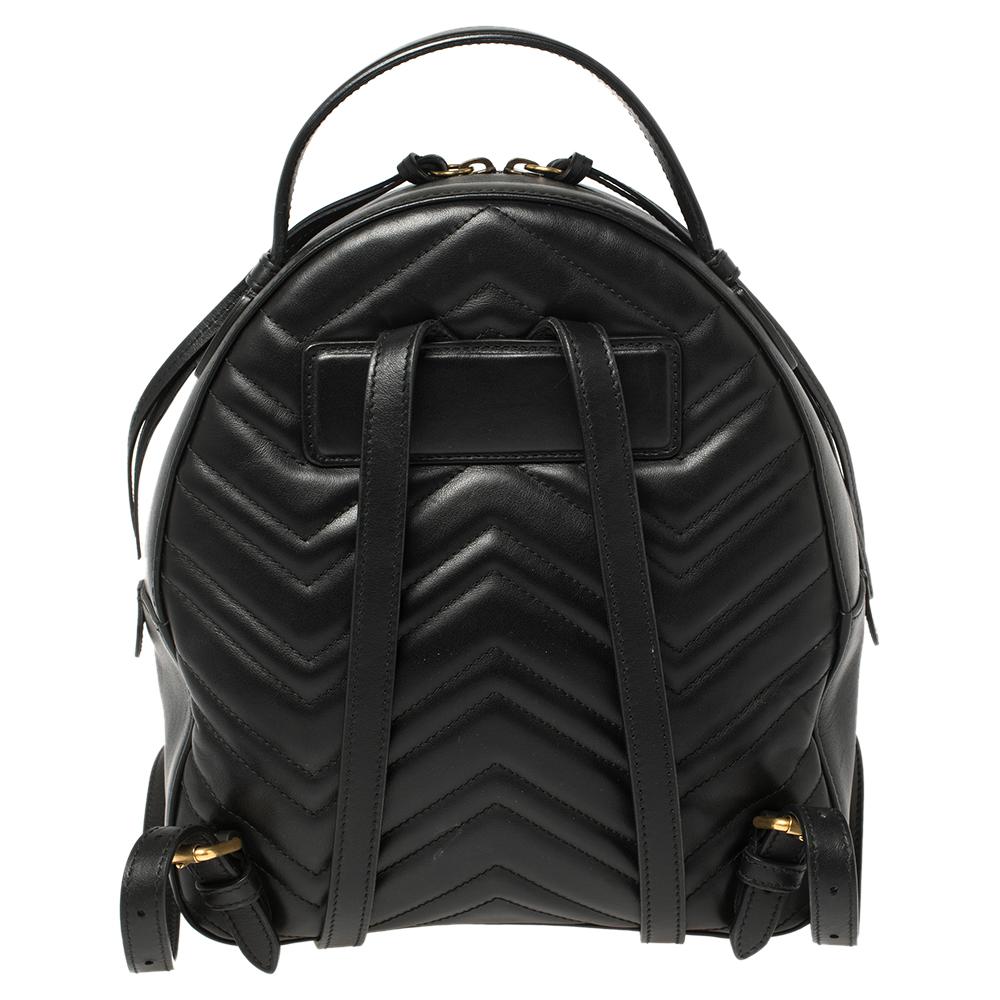 Gucci's cult-favorite GG Marmont backpack simply exudes elegance and is a timeless creation to own. Crafted in matelassé leather, it is decorated with the iconic GG logo and has a spacious Alcantara interior that offers plenty of room for all of
