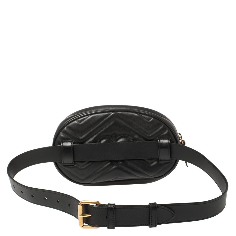 This Gucci belt bag has been exquisitely crafted from leather in a matelasse pattern all over and equipped with a zipper fastening that opens to a well-sized suede interior. On the front, there is a GG logo, and an adjustable belt is provided for