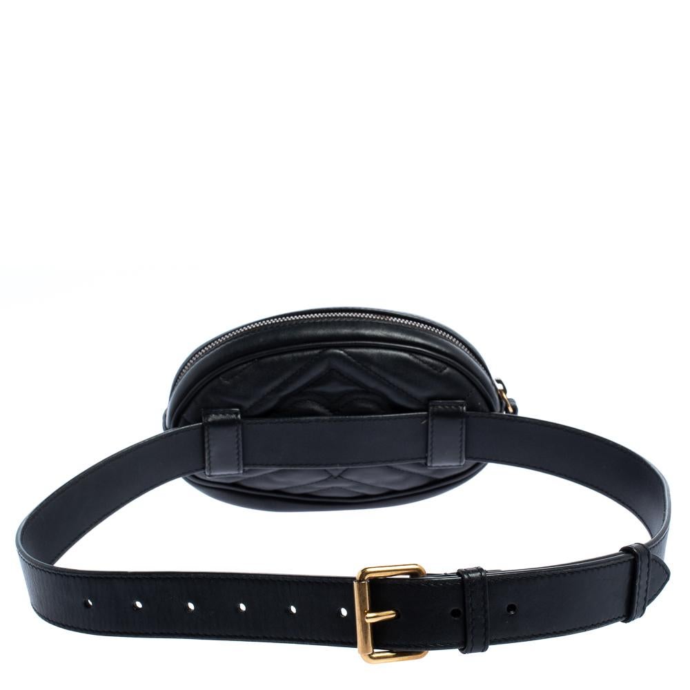 This Gucci belt bag has been exquisitely crafted from leather in a matelasse pattern all over and equipped with a zipper fastening that opens to a well-sized Alcantara interior. On the front, there is a GG logo, and an adjustable belt is provided