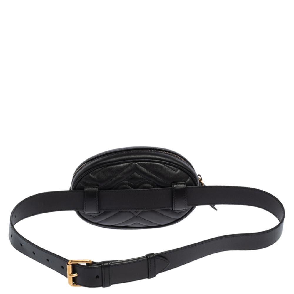 This black Gucci GG Marmont belt bag is the perfect accessory to throw over any outfit to add that extra touch of glam and luxury. Crafted from Matelassé leather, this bag is light, durable, and easy to carry, while channeling a fashionable flair