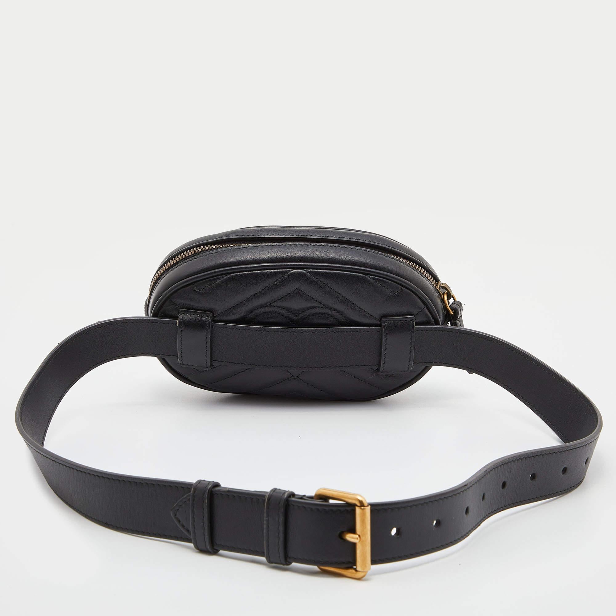 The Gucci GG Marmont belt bag is a stylish and versatile accessory. Crafted from black leather with matelassé stitching, it features the iconic GG logo, a flap closure, and an adjustable belt strap. Perfect for hands-free convenience and adding a