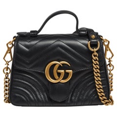 Gucci Schwarzes Matelassé-Leder Mini GG Marmont Top Handle Bag