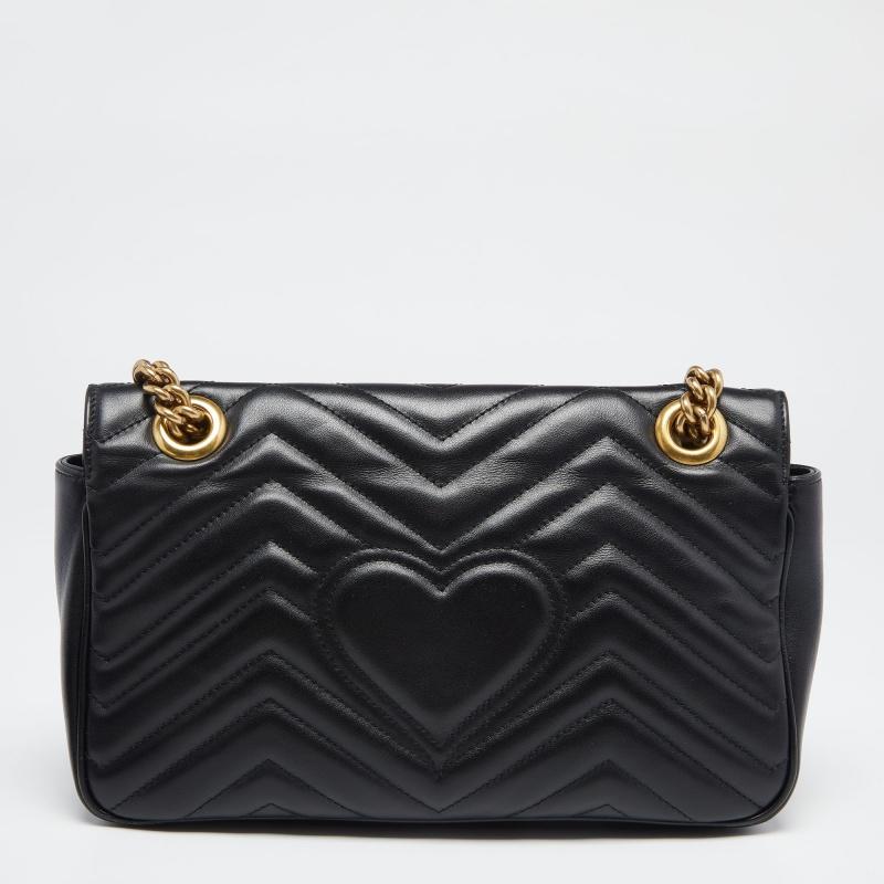 From one of the most exemplary collections of the House, this GG Marmont shoulder bag from Gucci will lend unending charm and aesthetics to your style. It has been crafted using black Matelassé leather, with a gold-toned GG motif embellishing the