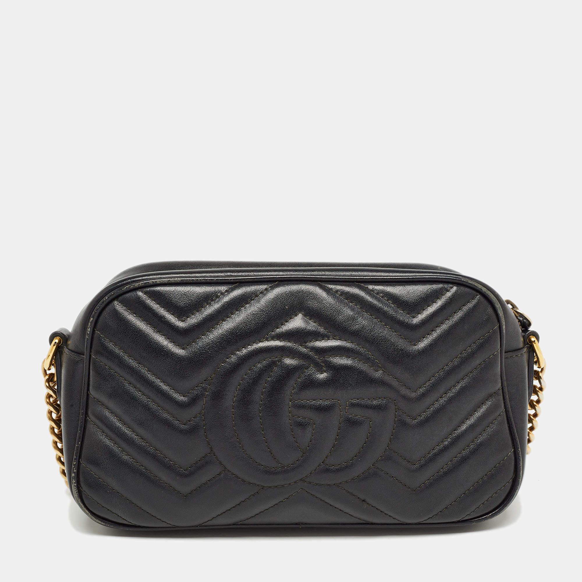The Gucci bag exudes timeless elegance. Crafted from supple black leather, its quilted matelassé pattern is adorned with the iconic GG logo. The shoulder bag seamlessly combines luxury and sophistication, making it a must-have accessory for the