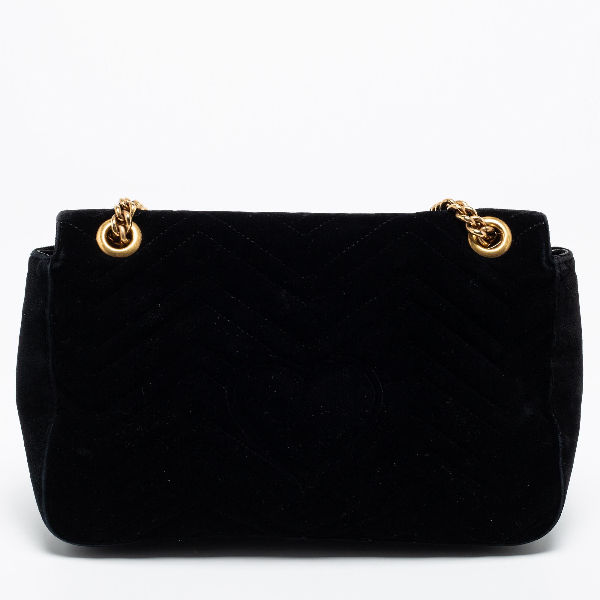 This Gucci GG Marmont shoulder bag is a timeless piece to last you season after season. This bag is made of black Matelassé velvet and will suit all your needs. It has GG logo detailing, a long shoulder strap, and a satin-lined interior.

