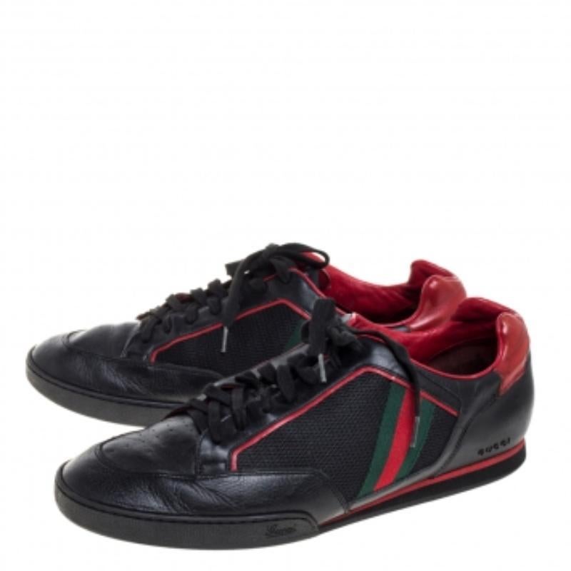 These tennis sneakers from Gucci are crafted from mesh fabric and leather and flaunt a low top frame. It features the signature web detailing on the side panels, round toes, and laces on the vamps. The black and red combination is the key detail of