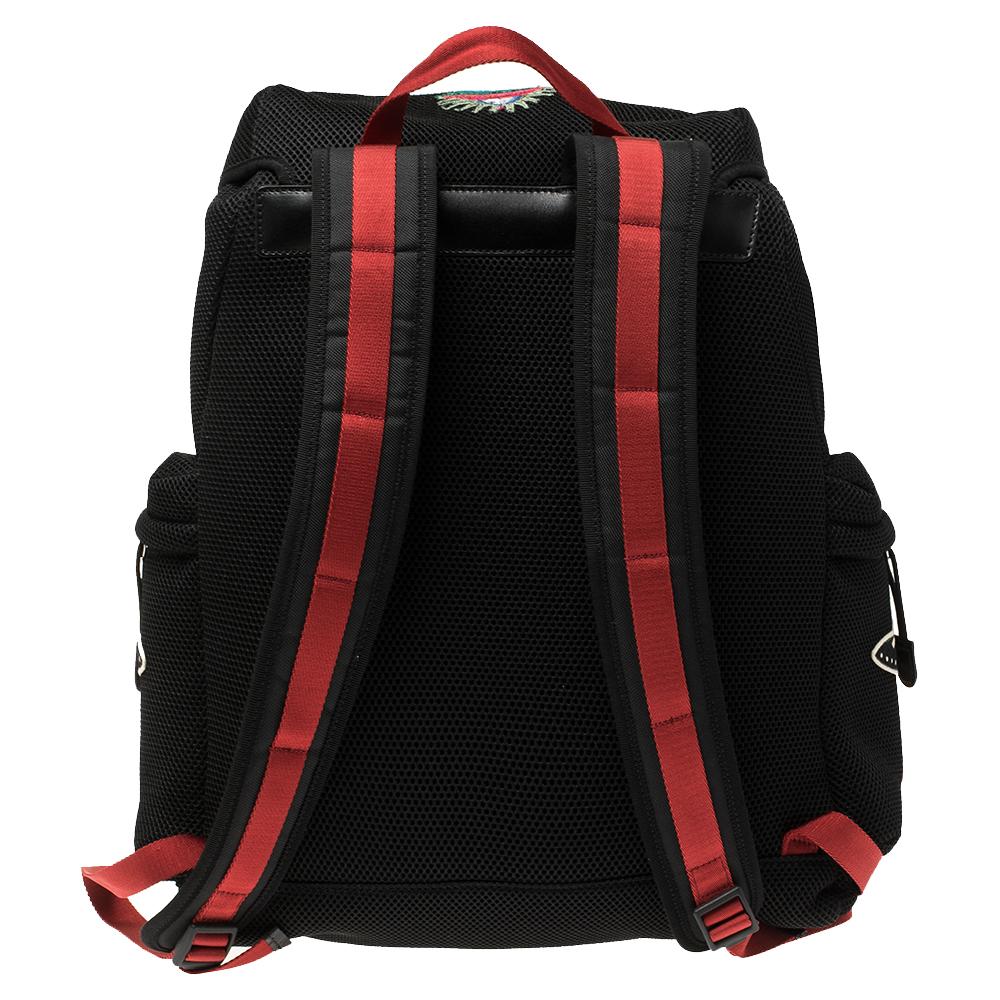 This vibrant backpack is from Gucci. The backpack features needle work and 'Hollywood' detailed on top, along with UFOs embroidered on the exterior. The drawstring closure opens to a nylon-lined interior that will hold all your essentials. The bag