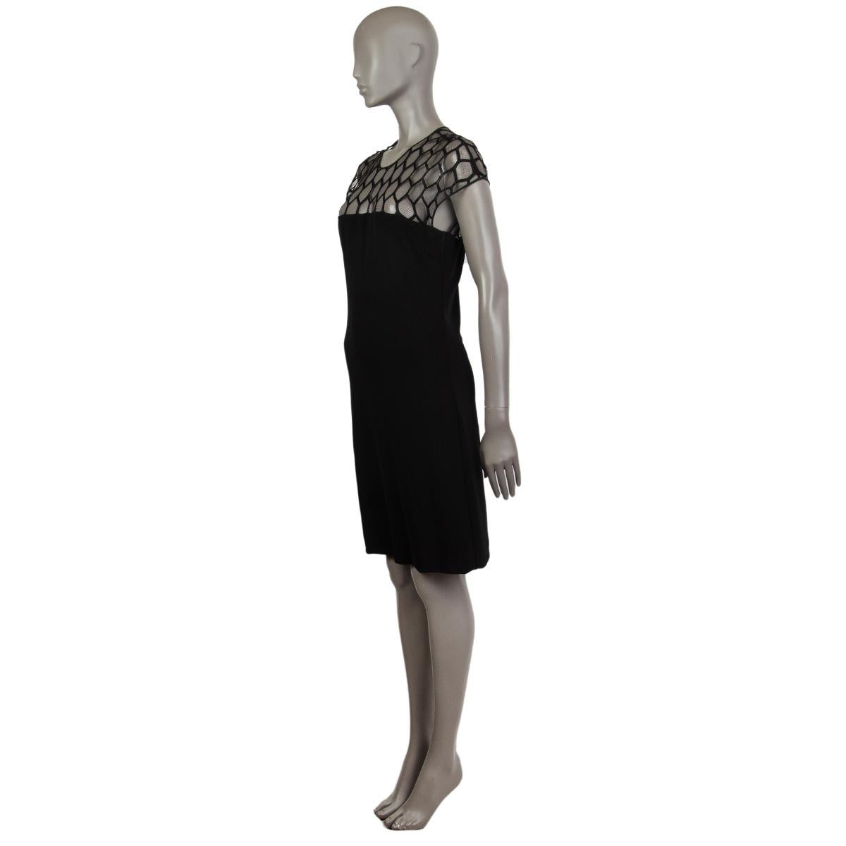 Gucci shift dress in black fabric. With mesh-lace top and keyhole back. Closes with fabric button behind the neck and invisible zipper on the back. Lined in black fabric. Has been worn and is in excellent condition.

Tag Size L
Size L
Shoulder Width
