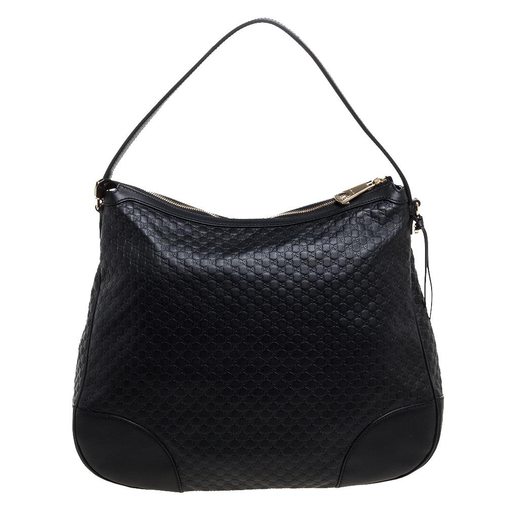The timeless black hue of this Gucci hobo bag gives it an elegant finish making a sophisticated option for everyday use. Crafted in Italy with the brand's signature Microguccissima leather, the hobo bag has a fabric-lined interior that is quite