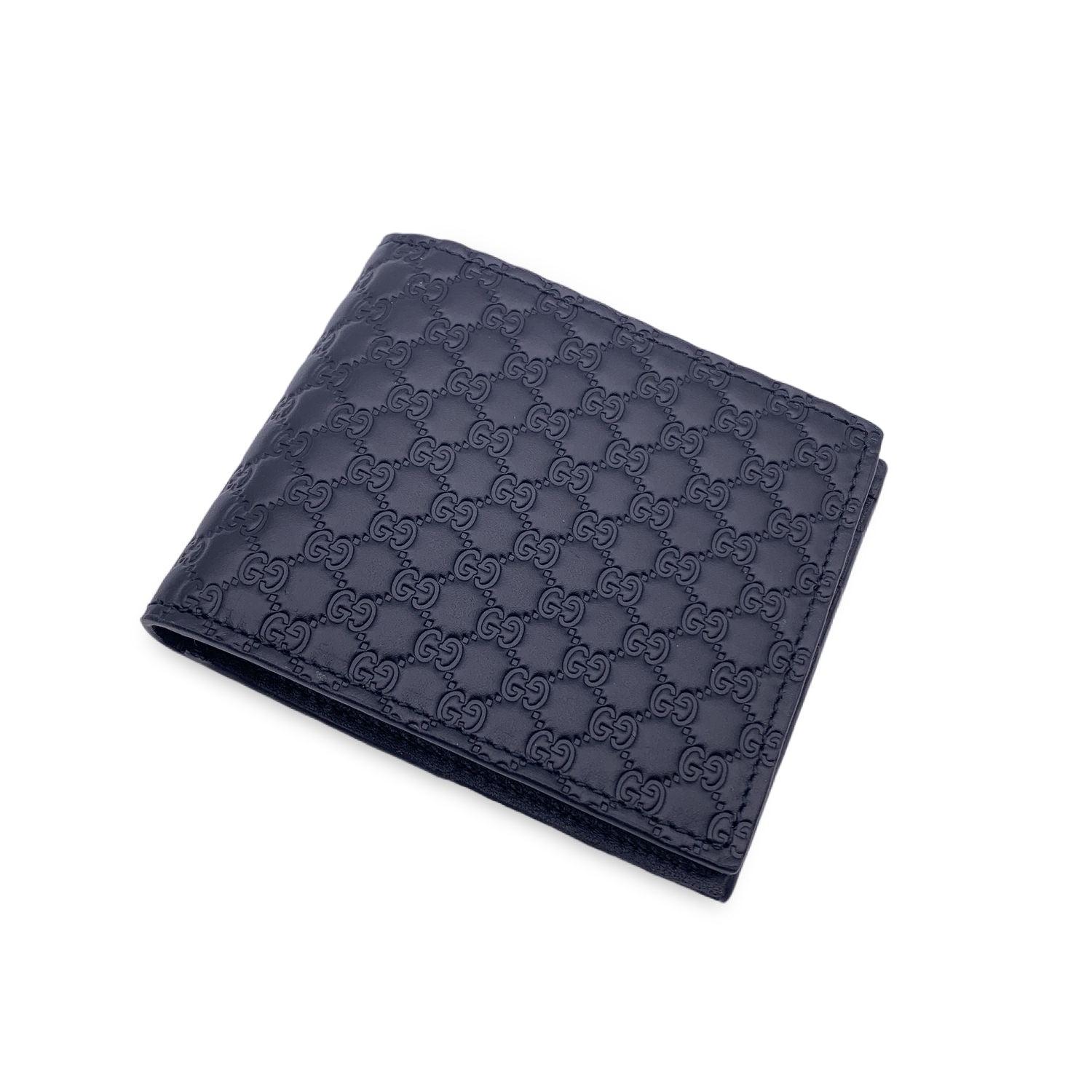 Beautiful Gucci black Microguccissima leather bifold wallet. 1 bill compartment, 1 coin compartment, 1 open pocket and 4 credit card slots. 'Gucci - Made in Italy' and serial number engraved inside. Details MATERIAL: Leather COLOR: Black MODEL: -