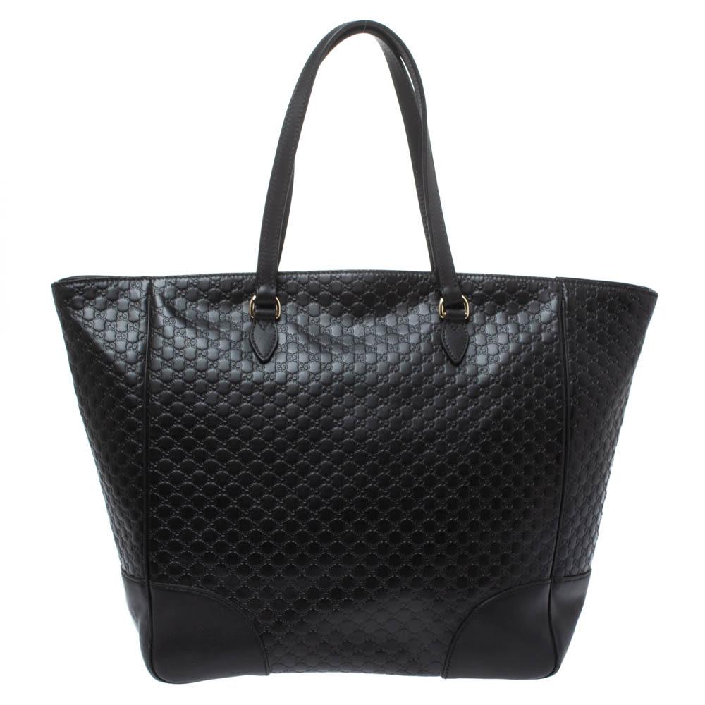 The timeless black hue of this Gucci tote gives it an elegant finish making a sophisticated option for everyday use. Crafted with Microguccissima leather, the bag has a canvas-lined interior, quite roomy to house everything you need on a daily
