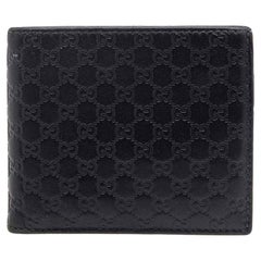 Gucci Microguccissima Geldbörse mit Clipverschluss aus schwarzem Leder