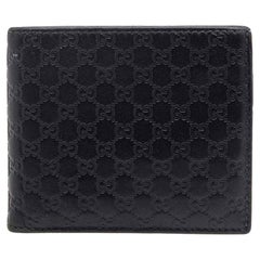 Gucci - Portefeuille à clips de monnaie en cuir microguccissima noir