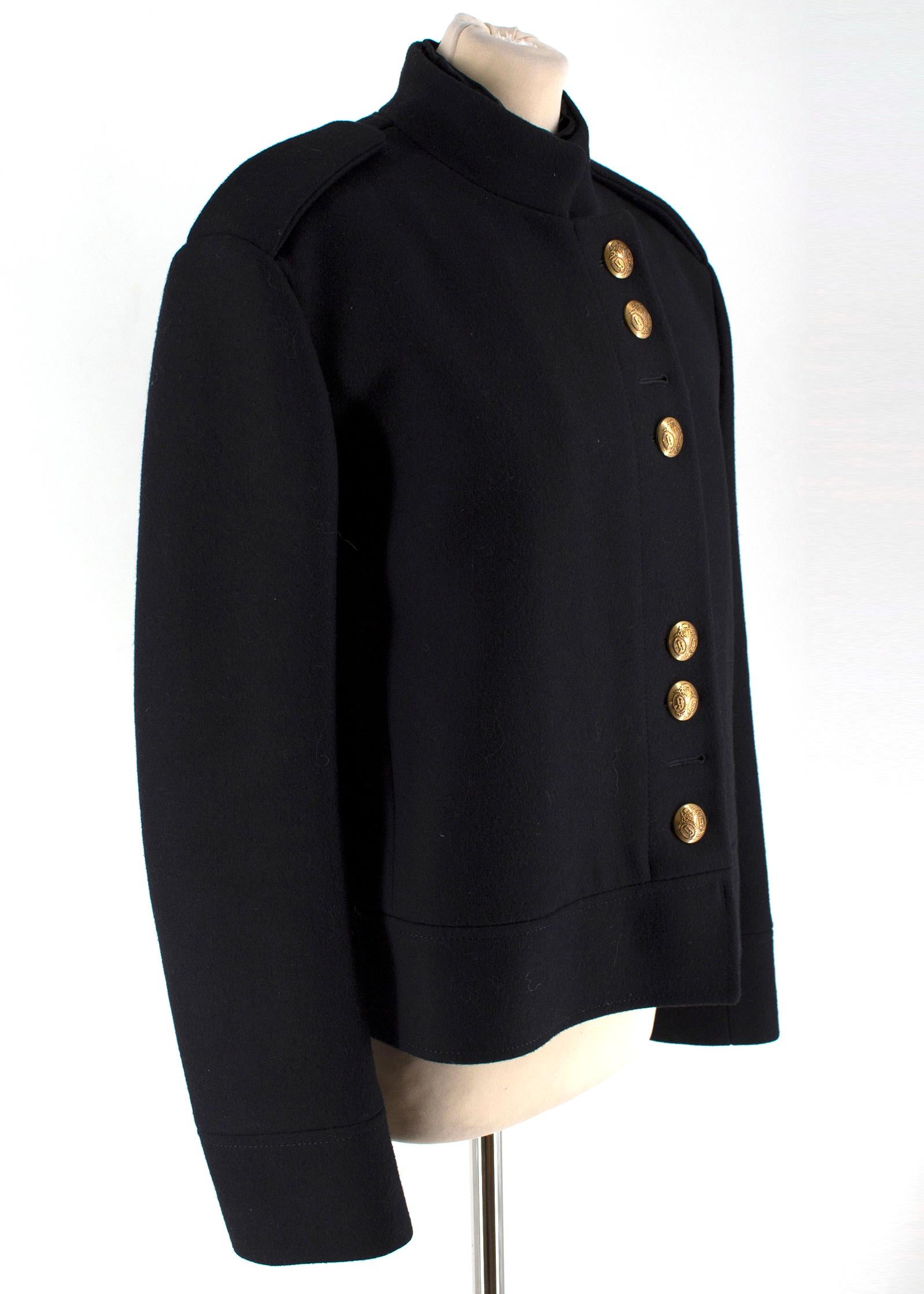 Gucci Black Military Wool Coat

-Black wool coat with gold toned buttons
-Embossed buttons
-Epaulettes
-Quilted lining
-Button closure with hook and eye closure

Please note, these items are pre-owned and may show signs of being stored even when