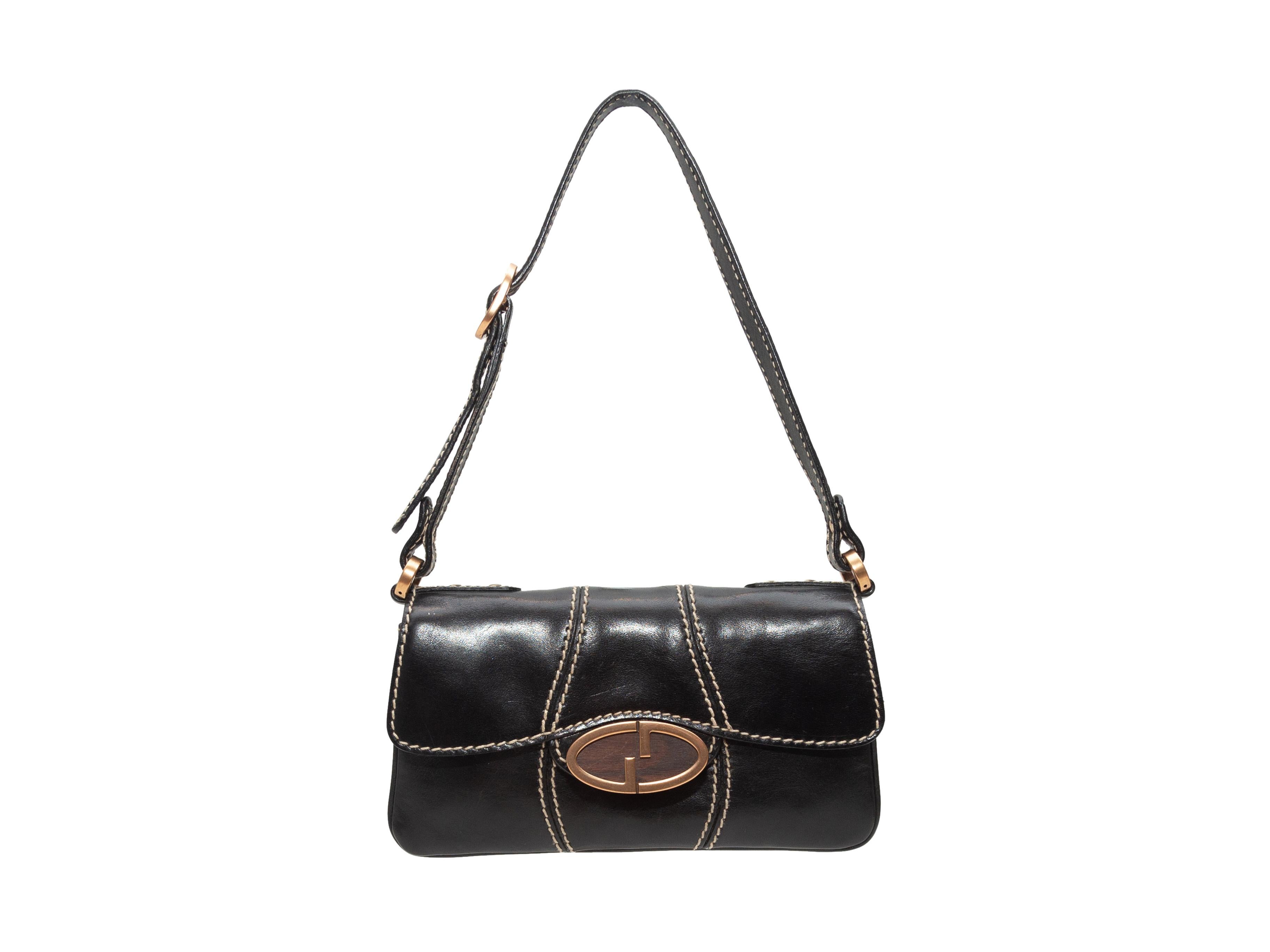 Product details: Vintage Black Gucci Mini Leather Shoulder Bag. This bag features a leather body, gold-tone hardware, contrast stitching, a single flat strap, and a GG closure at the front flap. 7.5