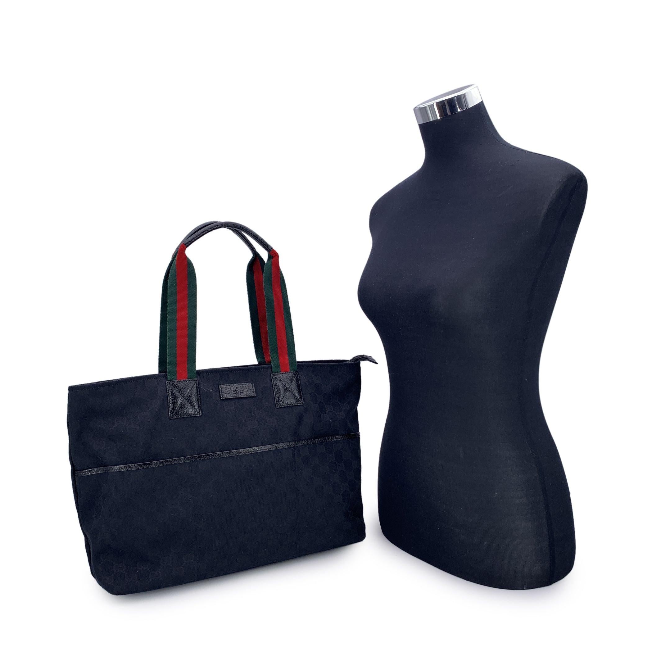 Beautiful Gucci tote in black monogram canvas. 3 front open pockets. Upper zipper closure. Black lining, 1 side zip pocket and 2 side open pockets inside. 'GUCCI - Made in Italy' tag inside (with serial number on its reverse) Condition A - EXCELLENT