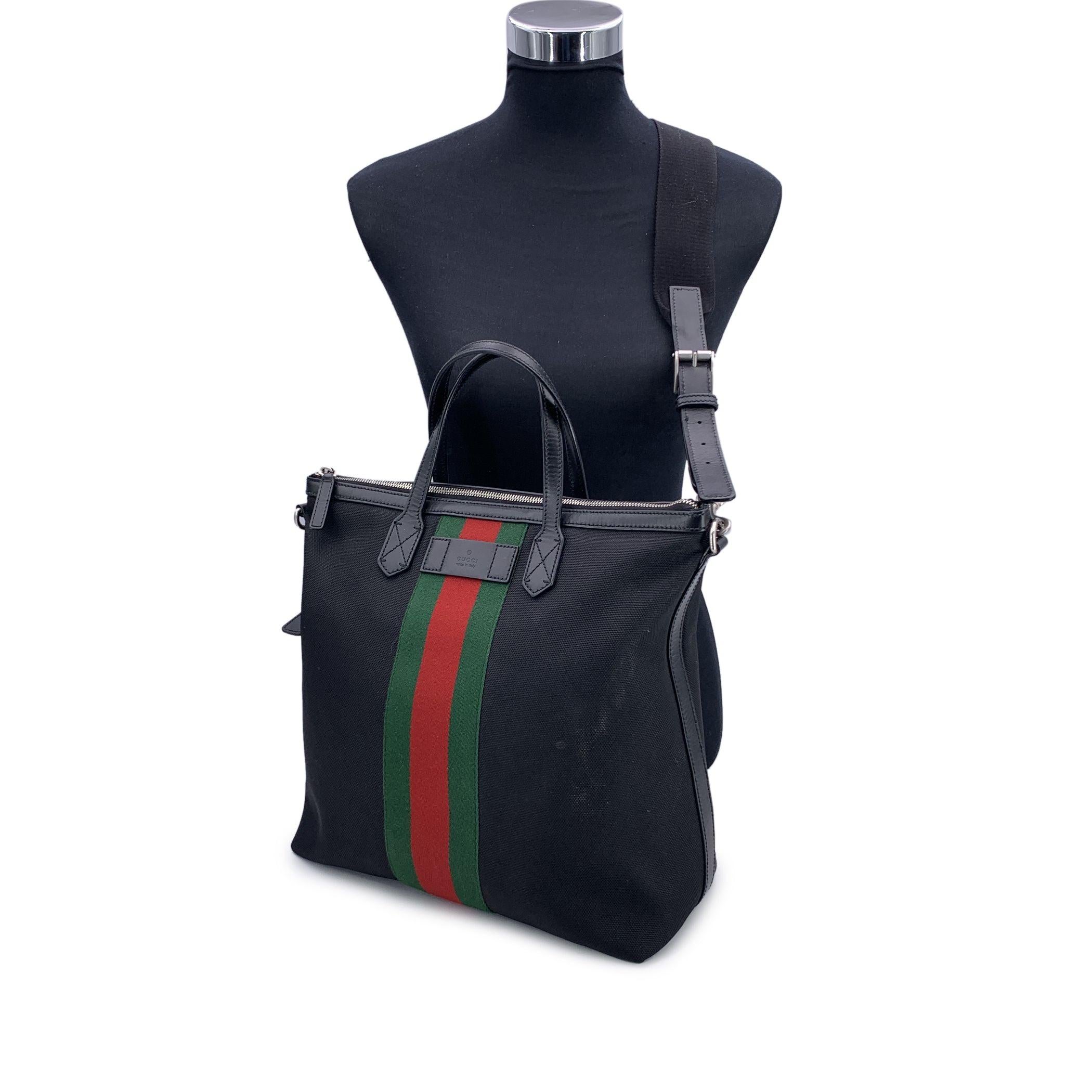 Discover the perfect blend of style and functionality with this authentic Gucci Techno Canvas Web Vertical 2Way Tote. Crafted from durable techno canvas in black color, the bag is accented with Gucci's signature green/red/green webbed stripe,