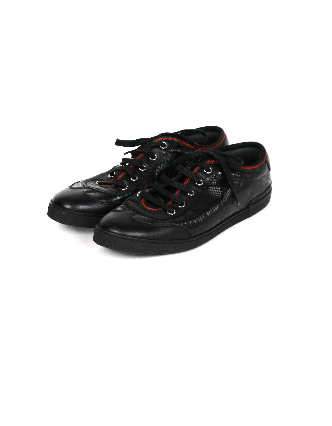 Gucci Black Monogram Sneakers w/ Leather Trim sz 36.5

Made In: Italy
Color: Black
Hardware: Silvertone
Materials: Leather
Closure/Opening: Front Laces
Overall Condition: Excellent pre-owned condition, minor wear on the soles and small scuffs on the