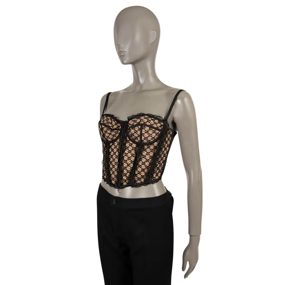 100% authentic Gucci corset bustier top in black GG net with nude lining (please note the content tag is missing). Features a lingerie silhouette, lace trims, adjustable straps and sweetheart neckline. Has been worn and is in excellent