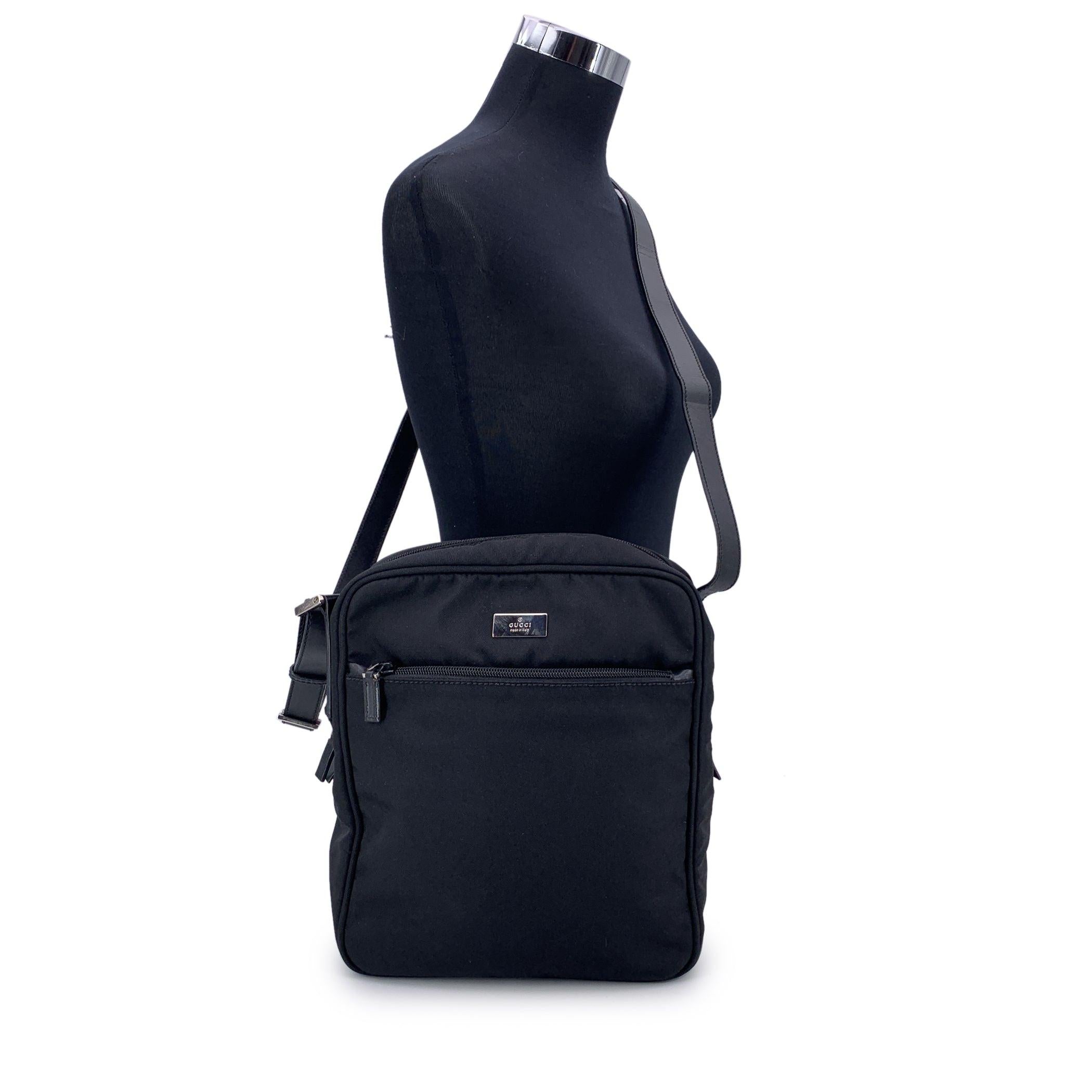 Designed with versatility and city-smart style in mind, this Gucci black nylon canvas crossbody messenger bag is a unisex essential that blends function with iconic design. Crafted from durable black nylon with a minimalist edge, it's built for life