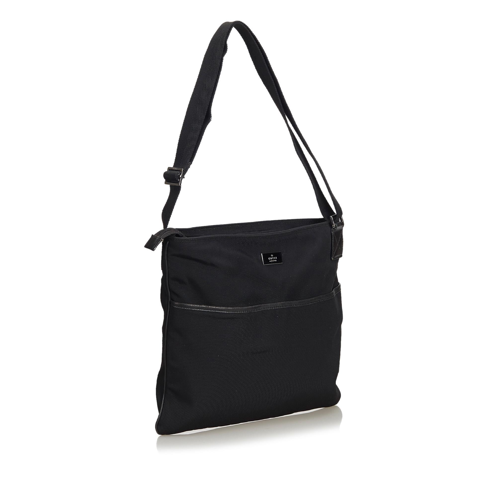 This crossbody bag features a nylon body, flat strap, top zip closure, exterior slip pocket, and an interior zip pocket. It carries as AB condition rating.

Inclusions: 
This item does not come with inclusions.

Dimensions:
Length: 29.00 cm
Width: