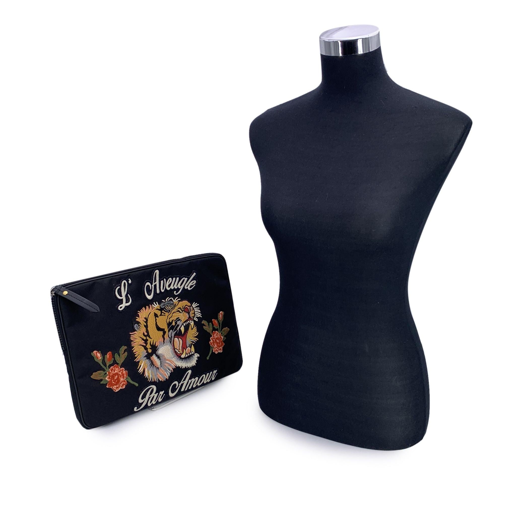 For those who believe utility should never come at the cost of style, the Gucci L'Aveugle Par Amour Computer Case is the ultimate statement piece. Part of Gucci's boldly romantic vision under Alessandro Michele, this tech accessory fuses fashion and