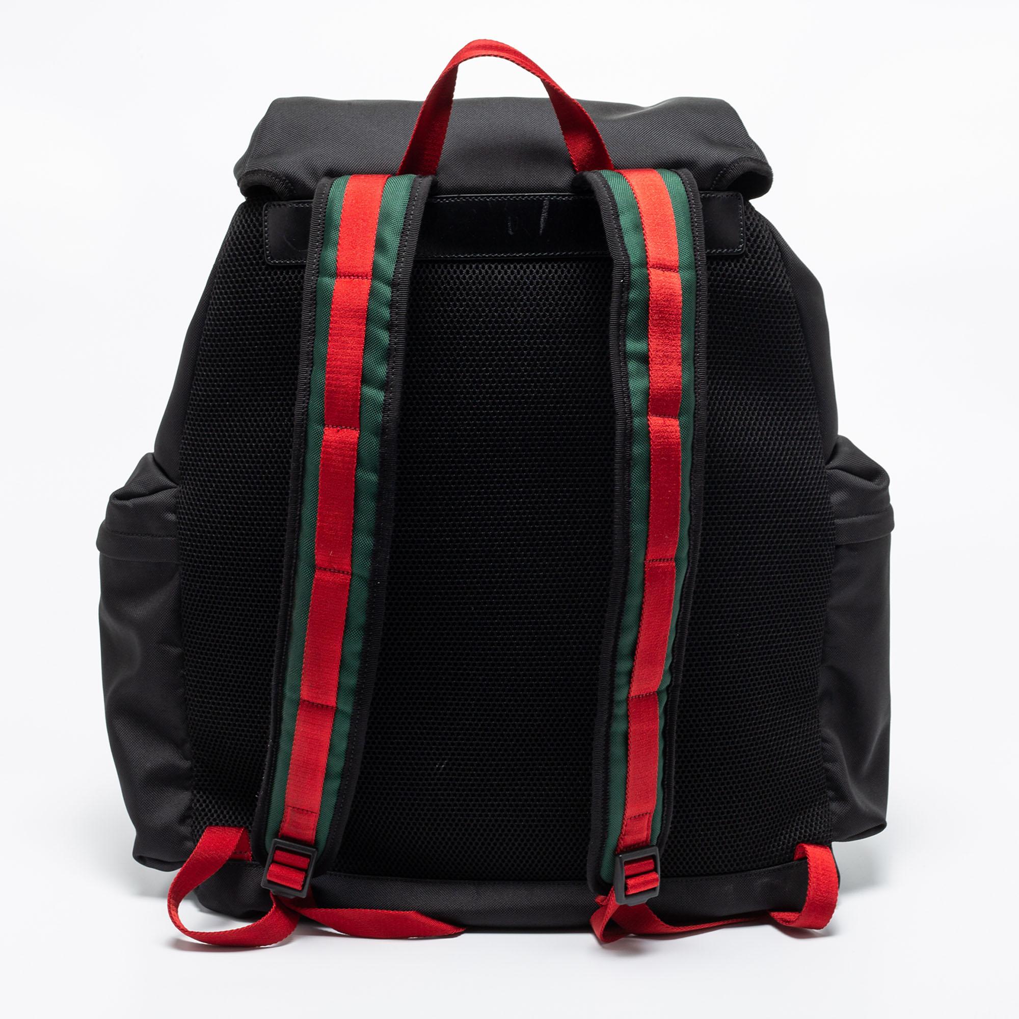 This light backpack by Gucci is carefully crafted from black nylon. The drawstring closure reveals a spacious interior that accommodates essentials quite comfortably. Just the right backpack for short trips!

