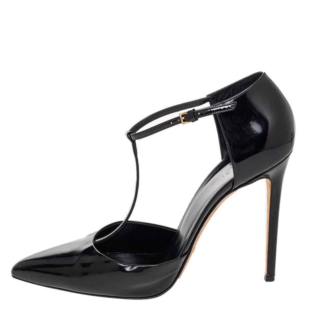 These chic pumps from Gucci can turn heads with their glossy patent leather exterior and elegant T-strap design. They feature modified point toes, tapering lacquered stiletto heels, adjustable ankle straps with a gold-tone buckle, padded insoles,