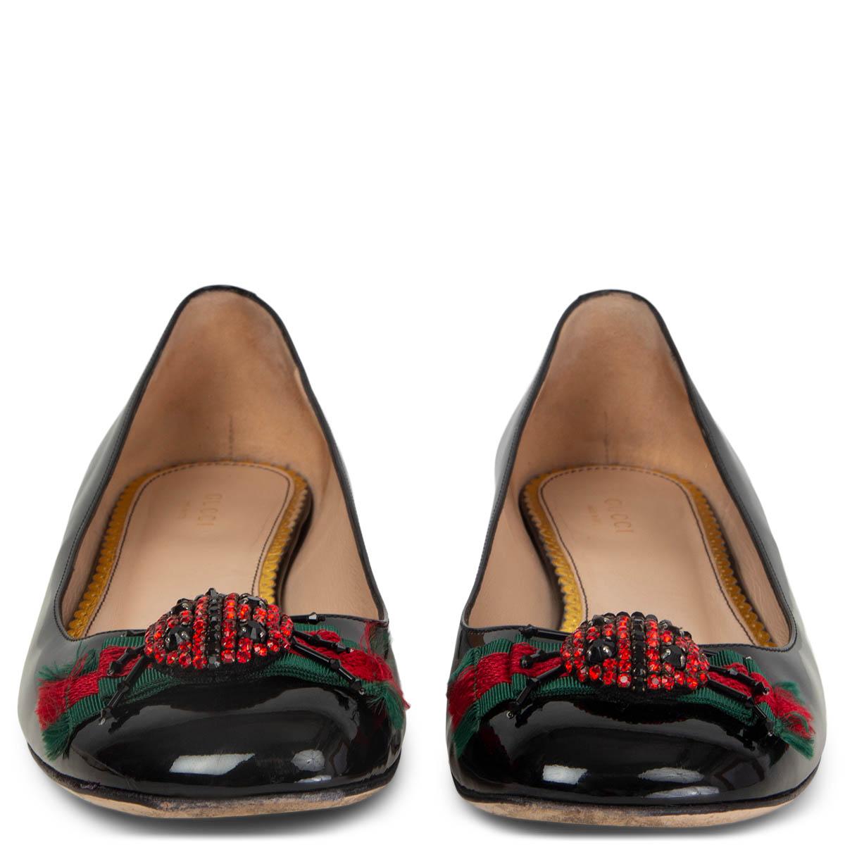 100% authentic Gucci 2016 Lexi Ladybug Embellished Ballet Flats in black patent leather featuring signature red & green grosgrain bow and crystal encrusted embroidered ladybug. Have been worn with a lot of wear to the soles. Overall in excellent