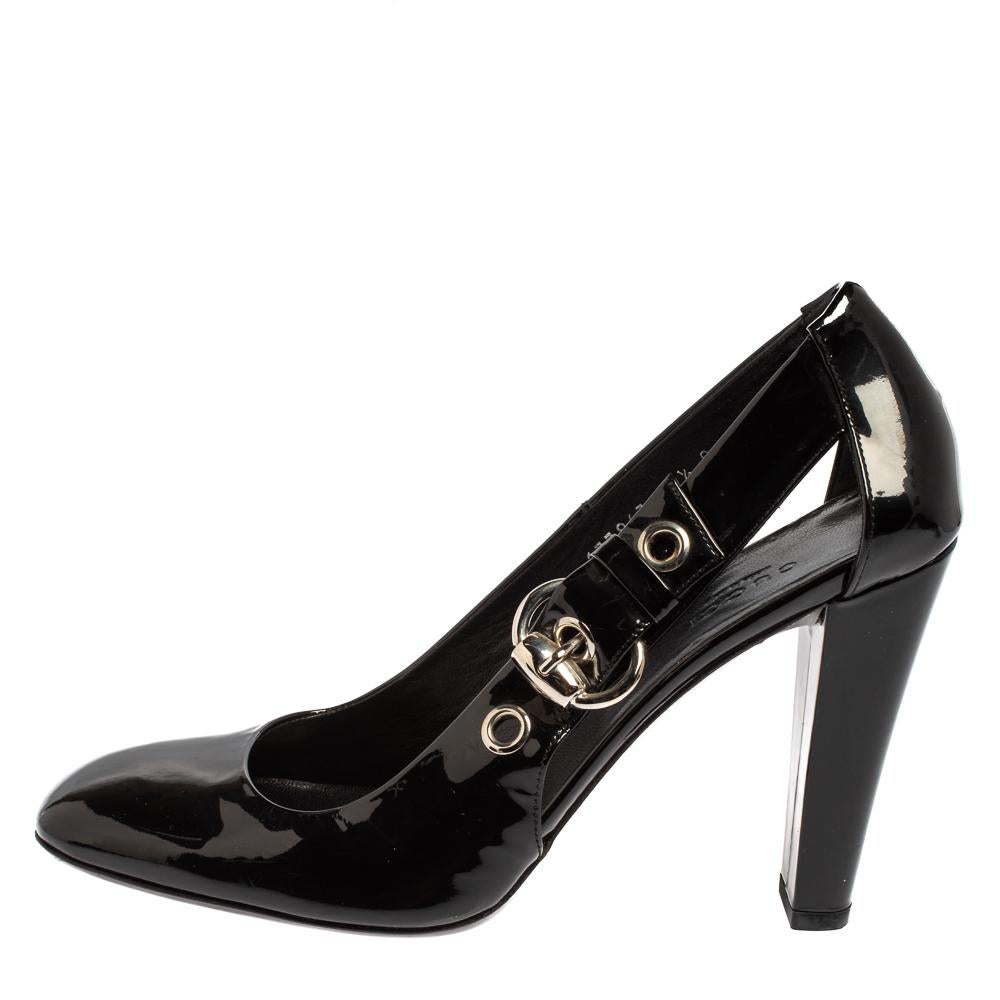 Exhibiting beauty with every detail, these stunning pumps for women by Gucci are sure to look great on you. Crafted from black patent leather, they feature square toes, cut-out details, buckle accents, and 11 cm heels.

