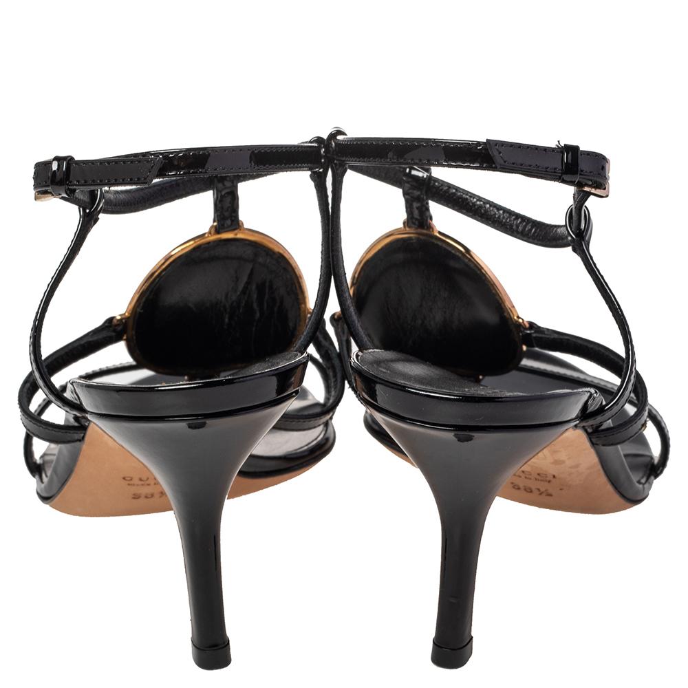 Complete your outfits with these beautiful Gucci sandals that are easy to wear and effortlessly stylish. Constructed in patent leather, these black-hued sandals feature thin straps and the famous GG logo for a signature look. They are set on 8.5 cm