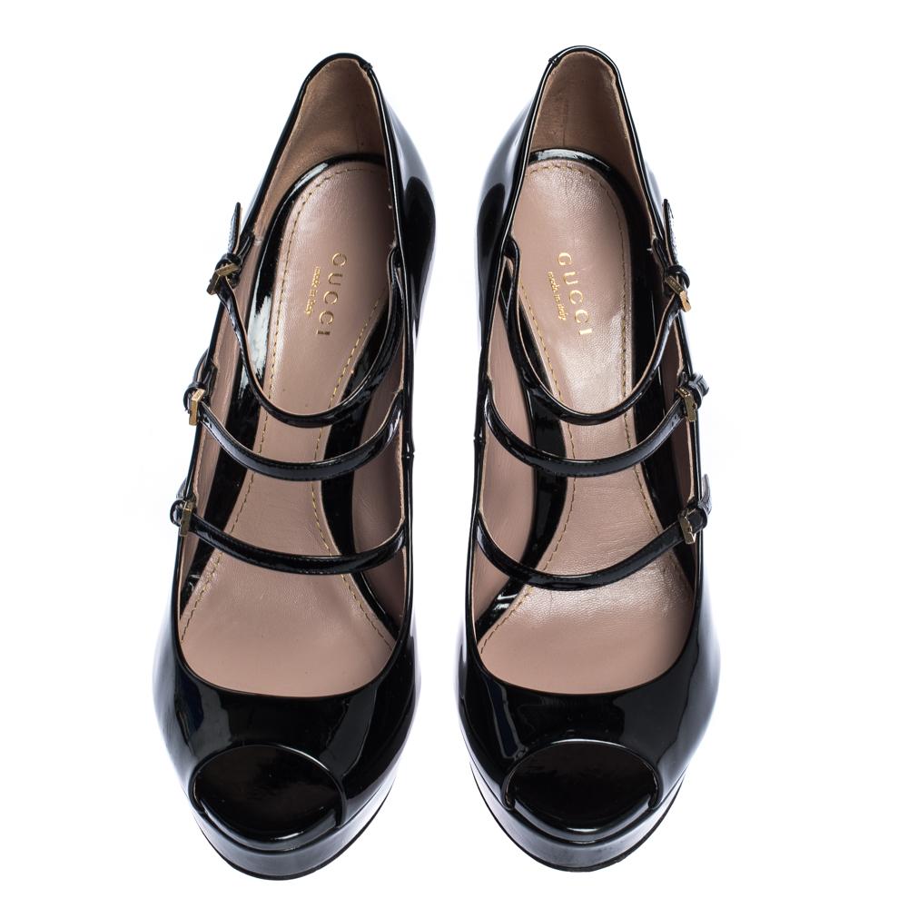 Add sophistication to your outfit with these Gucci Lisbeth pumps. Made from black-colored patent leather they are coupled with peep toes, three buckle adjustable straps across their vamps, platforms, gold-tone hardware, and 14 cm heels. Leather
