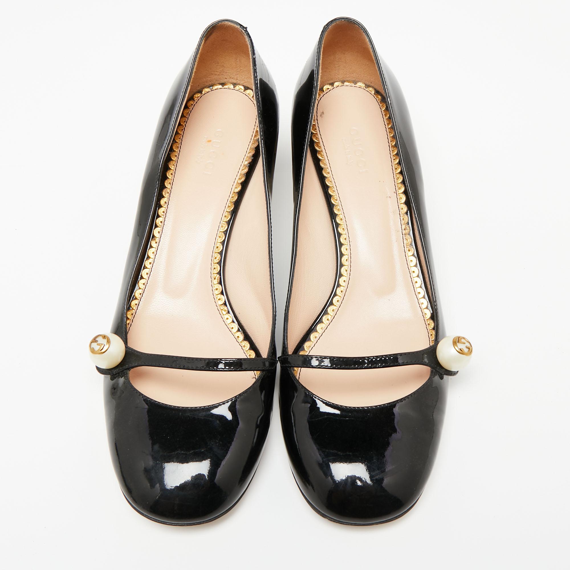Presented by the House of Gucci, these iconic pumps remain admirable in style and design. They are created using black patent leather on the exterior and showcase pearl embellishments on the upper. They are completed with block heels and will surely