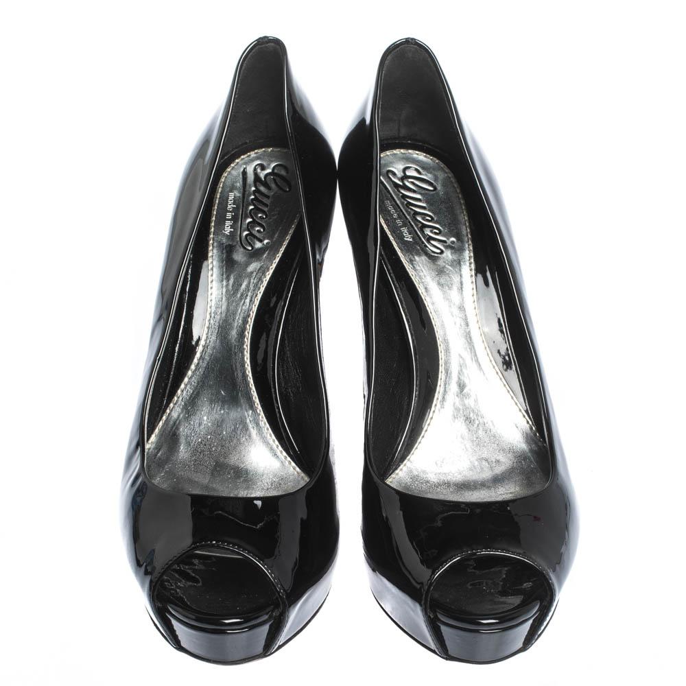 You can never go wrong with these pumps from Gucci. Crafted from patent leather, they have a glossy exterior and come in a classic shade of black. They are styled with peep toes, platforms and high 11 cm heels. They are finished with leather soles.

