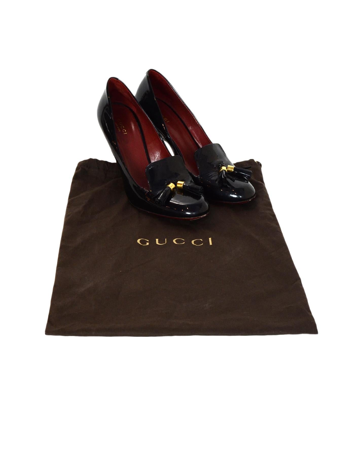 Gucci Black Patent Leather Pumps Heels W/ Tassel Sz 40

Made In: Italy
Color: Black, gold
Hardware: Goldtone
Materials: Patent leather, metal
Closure/Opening:  Slide on
Overall Condition: Excellent pre-owned condition with exception of some