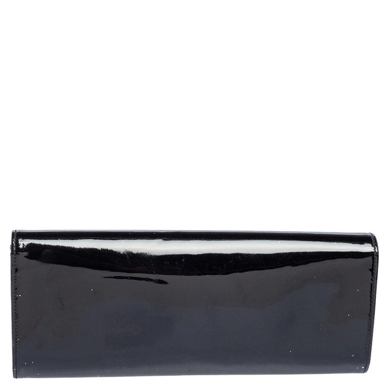 Highlight your outfit with this classic Romy clutch by Gucci. The patent leather exterior is accented with a gold-tone buckle detailing. The snap magnetic closure opens to satin-lined interior.

Includes: Info Booklet, Original Dustbag