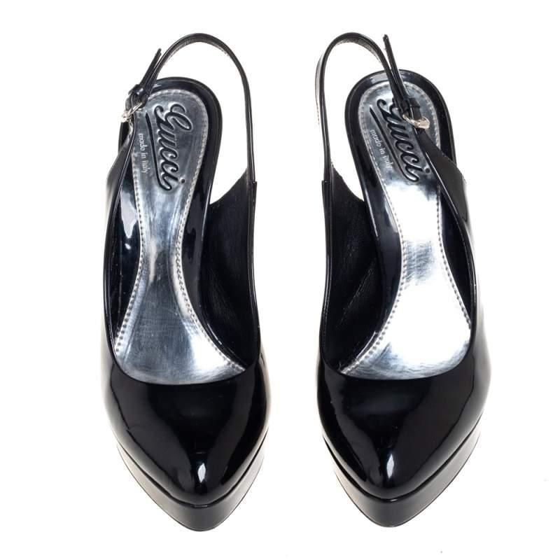 These black patent leather sandals have a minimalist yet chic design that blends effortlessly with any outfit. They come with buckled slingbacks and high stiletto heels. These almond-toe sandals from the house of Gucci will add an understated