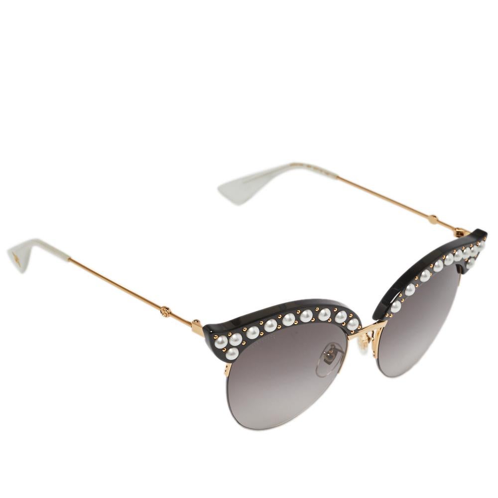 This pair of sunglasses from Gucci is in tune with the high-end, effortless style the brand is known for. The grey gradient lenses come enclosed in cate eye frames embellished with faux pearls and held by slim temples enhanced with the brand's