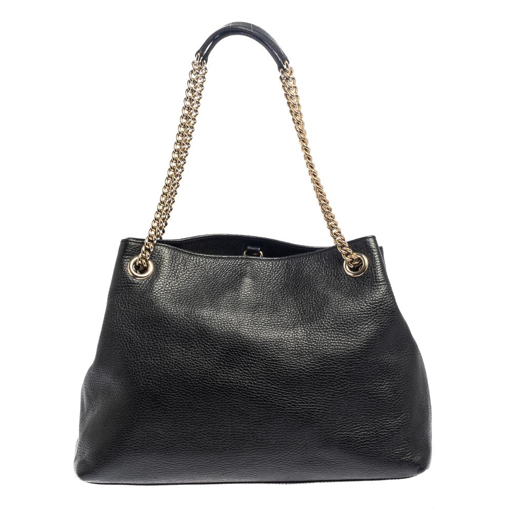 This Soho tote is one of the many designs by Gucci that is loved by women worldwide. The bag is constructed from pebbled leather and designed with the signature GG on the front. It features a spacious canvas interior for your essentials, two chain